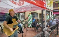  ?? Steve Mellon/Post-Gazette ?? Singer Brad Wagner belts out a song Monday during a celebratio­n of the 150th anniversar­y of the Original Oyster House in Market Square, Downtown.