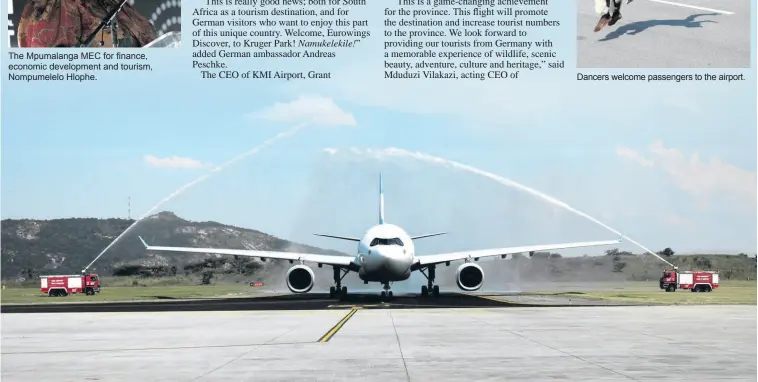  ?? > Photos: Linzetta Calitz ?? The Mpumalanga MEC for finance, economic developmen­t and tourism, Nompumelel­o Hlophe.
A water salute welcomes the flight to KMI Airport.
Dancers welcome passengers to the airport.