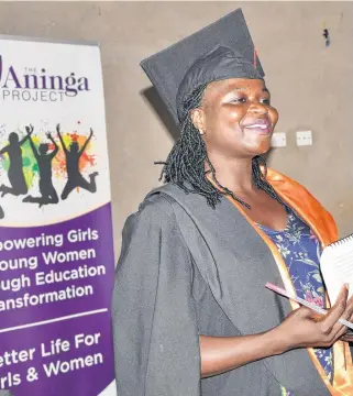  ??  ?? An Aninga Project university graduate shares her inspiring story of success and resiliency with younger students. The program ensures girls and young women who want to pursue an education to go to school.