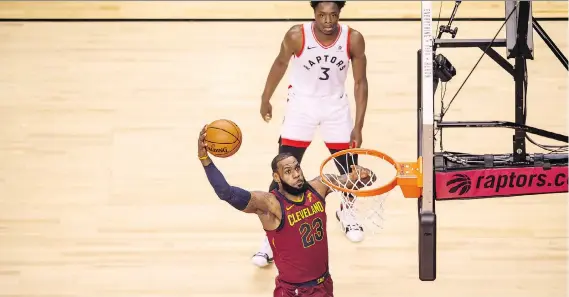  ?? PETER J. THOMPSON ?? Cleveland’s LeBron James makes a dunk in Game 1 of the second-round series between the Cavaliers and Raptors on Tuesday at the Air Canada Centre in Toronto.