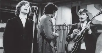  ??  ?? Early days: Van Morrison and Them performing in the Sixties. Below, Rory Gallagher on stage