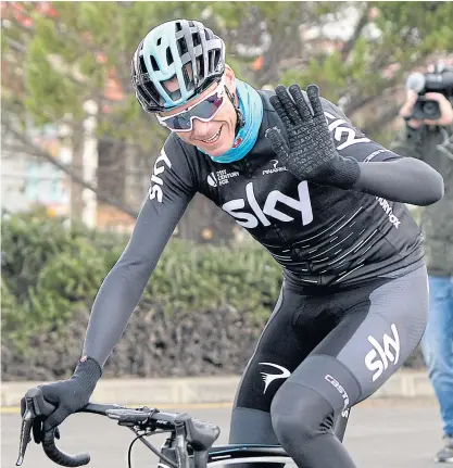  ??  ?? British rider Chris Froome waves while training in Mallorca, Spain on Thursday.