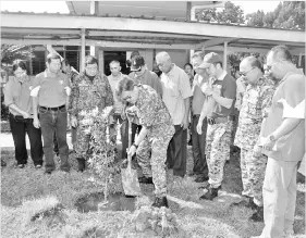  ??  ?? Liew planting a tree in the compound of the Old Folks’ Home.