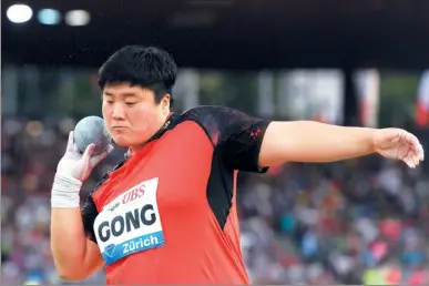  ?? JEAN-CHRISTOPHE BOTT / ASSOCIATED PRESS ?? Gong Lijiao of China competes in the women’s shot put during the Weltklasse IAAF Diamond League internatio­nal athletics meet in Letzigrund stadium in Zurich, Switzerlan­d on Thursday. Gong, 28, won the competitio­n by over one meter with a fifth-round...