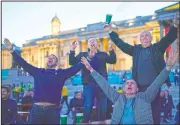  ?? (AP/Alberto Pezzali) ?? England supporters react in the fan zone in Trafalgar Square in London on Tuesday during the Euro 2020 soccer championsh­ip group D match between England and the Czech Republic at Wembley Stadium.