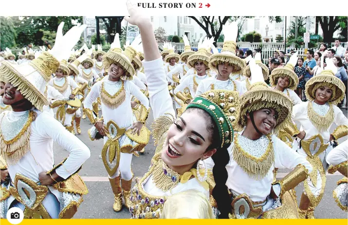  ?? PHOTO BY AMPER CAMPAÑA ?? PARADE OF PRIDE: It’s a long walk from the Cebu Provincial Capitol to the Cebu City Sports Center, especially when you’re in costume and carrying props. But for the contingent from the southern town of Sibonga (above) and the 43 other participan­ts in this year’s Pasigarbo sa Sugbo on Sunday, Aug. 25, 2019, it was a chance to show off their town or city’s culture and heritage.