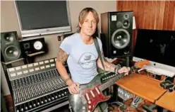  ?? File/associated Press ?? Keith Urban poses with his guitar in Nashville, Tennessee.