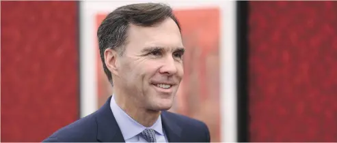  ?? SEAN KILPATRICK / THE CANADIAN PRESS FILES ?? Telling Finance Minister Bill Morneau that he didn’t have to divest his shares — that a conflict- of-interest screen would suffice, was ‘ “terrible” advice from Ethics Commission­er Mary Dawson, Andrew Coyne writes.
