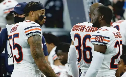  ?? DUANE BURLESON/AP ?? Linebacker Josh Woods (left) was ruled out of the game Sunday for a personal reason. Woods appeared in 19 plays on special teams in the Bears’ opener.