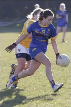  ??  ?? Clodagh Fox drives hard at the Antrim defence.