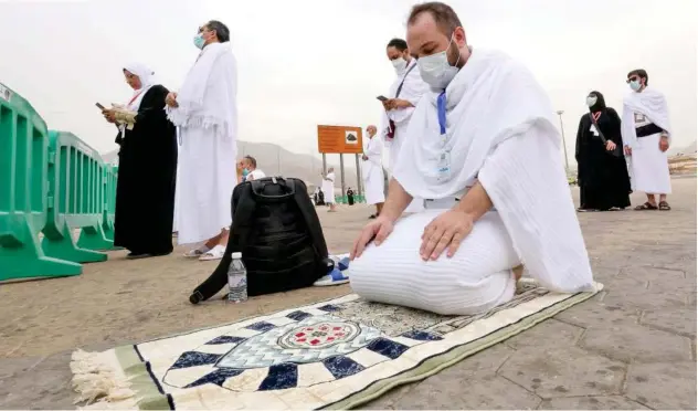  ?? Reuters ?? ↑ A pilgrim prays on the plain of Arafat during the annual Hajj pilgrimage in Makkah on Monday.