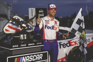  ?? ASSOCIATED PRESS ?? DENNY HAMLIN SMILES AFTER WINNING on Sunday in Long Pond, Pa. the NASCAR Cup Series auto race at Pocono Raceway