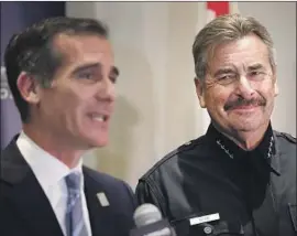  ?? Al Seib Los Angeles Times ?? POLICE CHIEF Charlie Beck, at right Friday with L.A. Mayor Eric Garcetti, led the LAPD through difficult cuts and efforts to reduce officers’ use of deadly force.