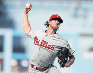  ??  ?? Phillies starting pitcher Aaron Nola throws during the second inning.