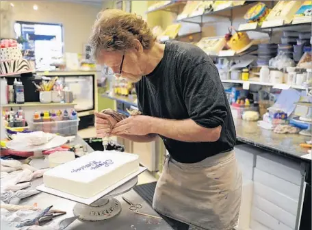  ?? Lindsay Pierce Denver Post ?? COLORADO says that Masterpiec­e Cakeshop owner Jack Phillips violated state civil rights law by refusing to serve a same-sex couple.