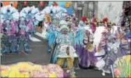  ?? SUBMITTED PHOTOS ?? Teddy Kudrick, center, and son Jake, right, march in last year’s Mummers Parade.