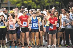  ?? Stephen Lam / Special to The Chronicle 2015 ?? A group of runners wait to begin the Dipsea race in Mill Valley in 2015. Women were not officially permitted to take part in the Dipsea until 1971.