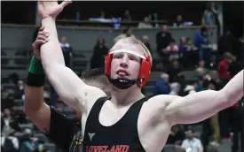  ?? NATHAN WRIGHT — LOVELAND REPORTER-HERALD ?? Loveland’s Walker Hayman has his hand raised after defeating Larry Hennings of Discovery Canyon on Thursday during the first round of the Class 4A state championsh­ips at Ball Arena.