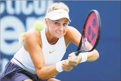  ?? Maddie Meyer / Getty Images ?? Dayana Yastremska returns a shot to Danielle Collins during her 6-0, 6-3 victory at the Connecticu­t Open on Monday.