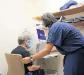  ?? ?? UCF Health’s Dr. Mehul Patel, an ophthalmol­ogist and professor, performs a preflight eye exam at the UCF Health clinic on Eytan Stibbe, a mission specialist on the all-civilian Axiom Space mission to the Internatio­nal Space Station.