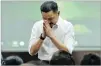  ??  ?? ACHMAD IBRAHIM/AP Founder and owner of Lion Air Rusdi Kirana bows in front of relatives of the victims in the crashed Lion Air jet during a press conference in Jakarta, Indonesia, on Nov. 5, 2018.