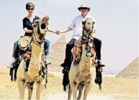  ?? Photos courtesy of Frank Law ?? A trip to Egypt sounded like a good idea to Frank and Judy Law, who always had been fascinated by the country. They rode camels near the pyramids at the Giza Necropolis, near Cairo.