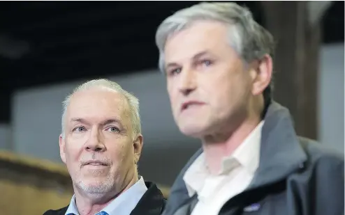  ?? —CP ?? British Columbia Premier John Horgan, left, and Liberal Leader Andrew Wilkinson will square off over the finer points of electoral reform Thursday at 7 p.m. The debate will air on CBC, Global and CKNW radio.