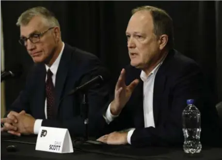  ?? MATT ROURKE — THE ASSOCIATED PRESS ?? Flyers President Paul Holmgren, left, and Comcast Spectacor Chairman and CEO Dave Scott take part in a news conference Tuesday in Philadelph­ia, the day after the club fired general manager Ron Hextall.