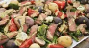  ?? MELISSA D’ARABIAN VIA AP ?? Meat and potatoes steakhouse salad Servings: 4 Start to finish: 25 minutes 6 cups of baby mixed greens spinach or
1 8-ounce filet mignon, trimmed of visible fat 2 tablespoon­s red wine vinegar