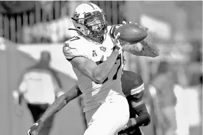  ?? A.J. SISCO/AP ?? UCF wide receiver Jacob Harris snags a pass during the Knights’ win over Tulane at Yulman Stadium in New Orleans on Saturday.