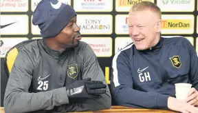  ??  ?? Ready to roll Efe Ambrose at a press call with manager Gary Holt