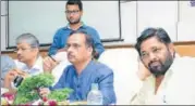  ?? HT PHOTO ?? Deputy CM Dinesh Sharma and BJP MP from Mohanlalga­nj Kaushal Kishore listening to traders at the meeting.