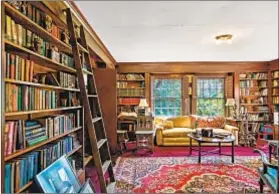  ??  ?? A LIBRARY, an off ice, 10 bedrooms, 12 bathrooms and a grand staircase are part of the 12,260 square feet of living space.