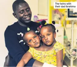  ??  ?? The twins with their dad Ibrahima