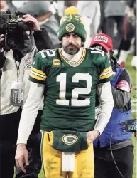  ?? Morry Gash / Associated Press ?? Packers quarterbac­k Aaron Rodgers walks off the field after the NFC championsh­ip game against the Buccaneers on Sunday in Green Bay, Wis.