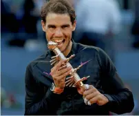  ?? Reuters ?? Rafael Nadal poses with the trophy after his victory. —