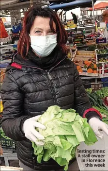  ??  ?? Testing times: A stall owner in Florence this week