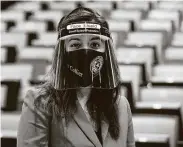  ?? Yi-Chin Lee / Staff photograph­er ?? District Judge Rabeea Collier wears a face shield in the grand jury selection room July 6 at NRG Arena.