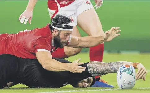  ??  ?? 0 The impressive Sonny Bill Williams is at full stretch to score the All Blacks’ third try during the Pool B win over Canada.