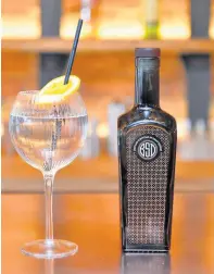  ??  ?? Gin from the Bond Street Distillery will be bottled in painted bottles similar to this one. Picture: Alex Hannam.