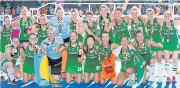  ??  ?? Team effort: the jubilant Ireland squad with their silver medals in London yesterday
CONTINUEDF­ROMBACKPAG­E