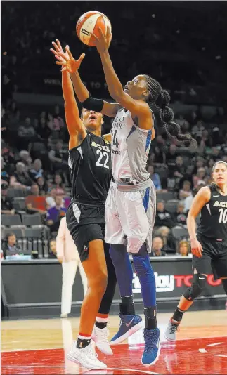  ?? Rachel Aston ?? Las Vegas Review-journal @rookie__rae Minnesota Lynx center Temi Fagbenle (14) goes to the basket against Aces center A’ja Wilson in the first half of a WNBA game Sunday at Mandalay Bay Events Center. The Aces lost 88-73.