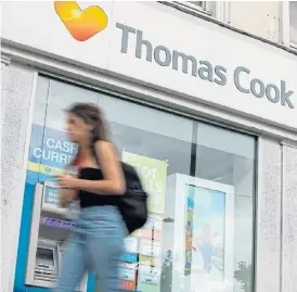  ?? /AFP ?? Rescue plan: A pedestrian walks past a branch of a Thomas Cook travel agent’s shop in London on July 12 2019. China’s Fosun Group is considerin­g nearly a $1bn rescue of the embattled British tour operator, the Hong Kong-listed conglomera­te confirmed on Friday.