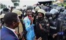  ?? Photograph: Abubaker Lubowa/Reuters ?? Ugandan presidenti­al candidate Bobi Wine is led into a vehicle by riot policemen in Luuka district on 18 November 2020.