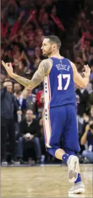  ?? CHRIS SZAGOLA — THE ASSOCIATED PRESS ?? The 76ers’ JJ Redick gestures after a 3-pointer in the second half Friday.