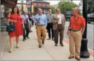  ?? CHRIS BARBER — DIGITAL FIRST MEDIA ?? Legislator­s and borough officials take a walking tour of Oxford with the goal of soliciting government funds and grants for the new Multimodal Transporta­tion Center. From left are: Mayor Lorraine Bell, OMI Director Brian Wenzka, Sawmill Grill owner...