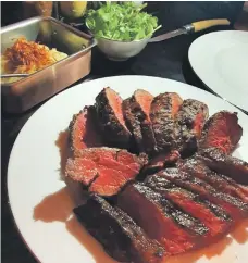  ??  ?? The medium-rare Denver cut and chateaubri­and (background) with truffle mashed potato at Oak Room at Abu Dhabi Edition