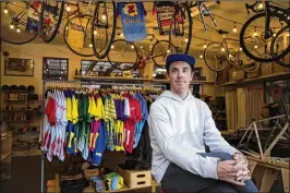  ?? GINA FERAZZI / LOS ANGELES TIMES ?? Team Dream owner Sean Talkington sits in his shop in a converted gas station in San Marino, Calif. Team Dream has over 30,000 Instagram followers — apparently enough to attract counterfei­ters on the other side of the world. But he’s focusing his energy...