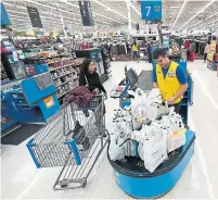  ?? DAVID J. PHILLIP THE ASSOCIATED PRESS FILE PHOTO ?? In recent years, Walmart’s sales have increased, but online profits are shrinking, leaving stores as the main profit engine.