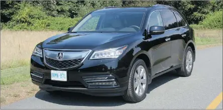  ??  ?? The 2014 Acura MDX has a great mix of ride comfort and sure-footed handling in a roomy utility package.